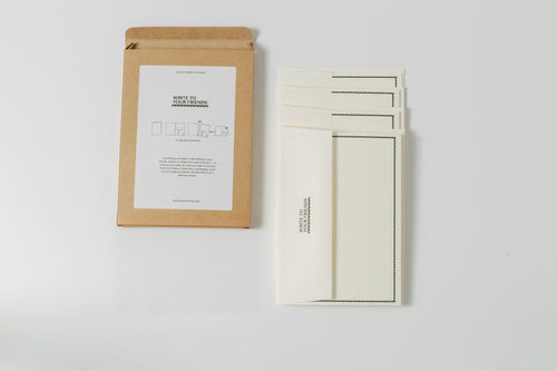 The Pack laid out with four cards and four natural cream envelopes